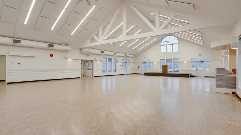 Bright main room with windows on three sides